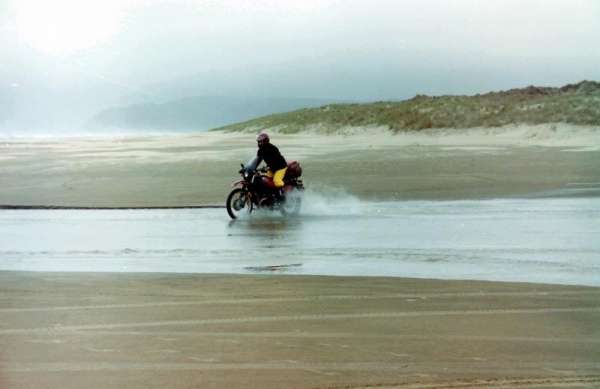 Crossing a stream on 90 Mile Beach