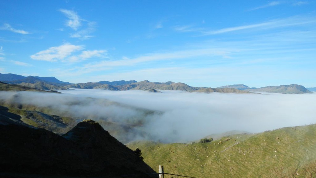Hills poking through the winter fog on The Motu